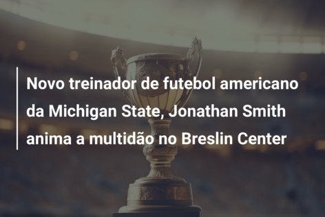 Novo treinador de futebol americano da Michigan State, Jonathan Smith anima a multidão no Breslin Center